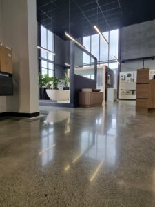 Harrison bloy showroom polishe concrete floor grind king Bathroom Showroom polished concrete floor Tauranga NZ Grinders