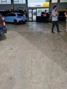 ac39eb7e-6bb4-48e0-bf8c-dfac565d6ef5 Workshop polished concrete floor Tauranga NZ Grinders before
