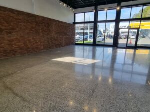 electric car showroom ebbets polished concrete floor before and after nz grinders 5 Industrial polished concrete floor Tauranga NZ Grinders
