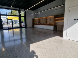 electric car showroom ebbets polished concrete floor before and after nz grinders 6 Industrial polished concrete floor Tauranga NZ Grinders