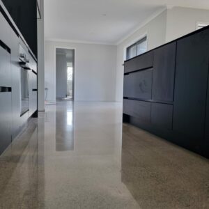 salt and pepper finish for a polished concrete floor4 polished concrete floor in kitchen with grey cabinets