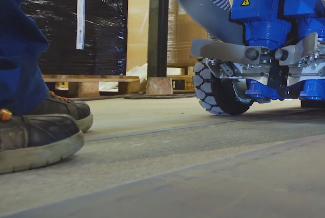 blastrac concrete planer NZ grinders floor close up image of the floor beneath a concrete chase cutter showing the channel cut and mans feet in safety boots in shot