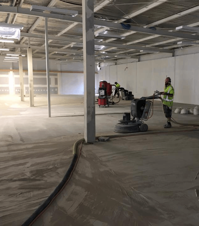 grinding machine nz grinders polished concrete floor tauranga hamilton taupo a concrete floor in a warehouse being prep grind for polished concrete