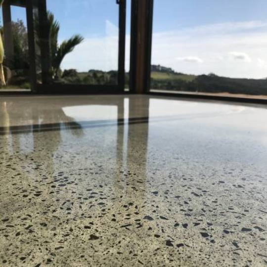Moderate Medium stone exposure NZ Grinders polished concrete Hamilton concrete floor with exposed stone