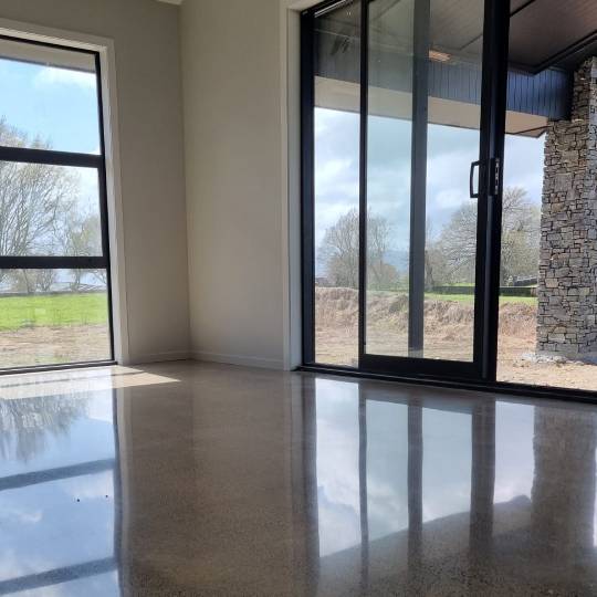 salt and pepper finish for a beach house polished concrete floor nz grinders tauranga1 (1) Salt and pepper finish for a beach house polished concrete floor nz grinders tauranga living room