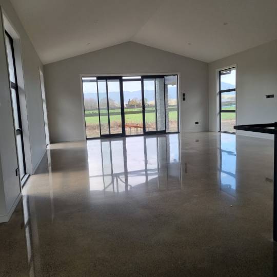 salt and pepper finish for a beach house polished concrete floor nz grinders tauranga3 (1) Salt and pepper finish for a beach house polished concrete floor nz grinders tauranga lounge area